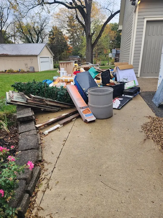Dumpster being loaded with debris for 30 Yard Dumpster Rental in Lakeland